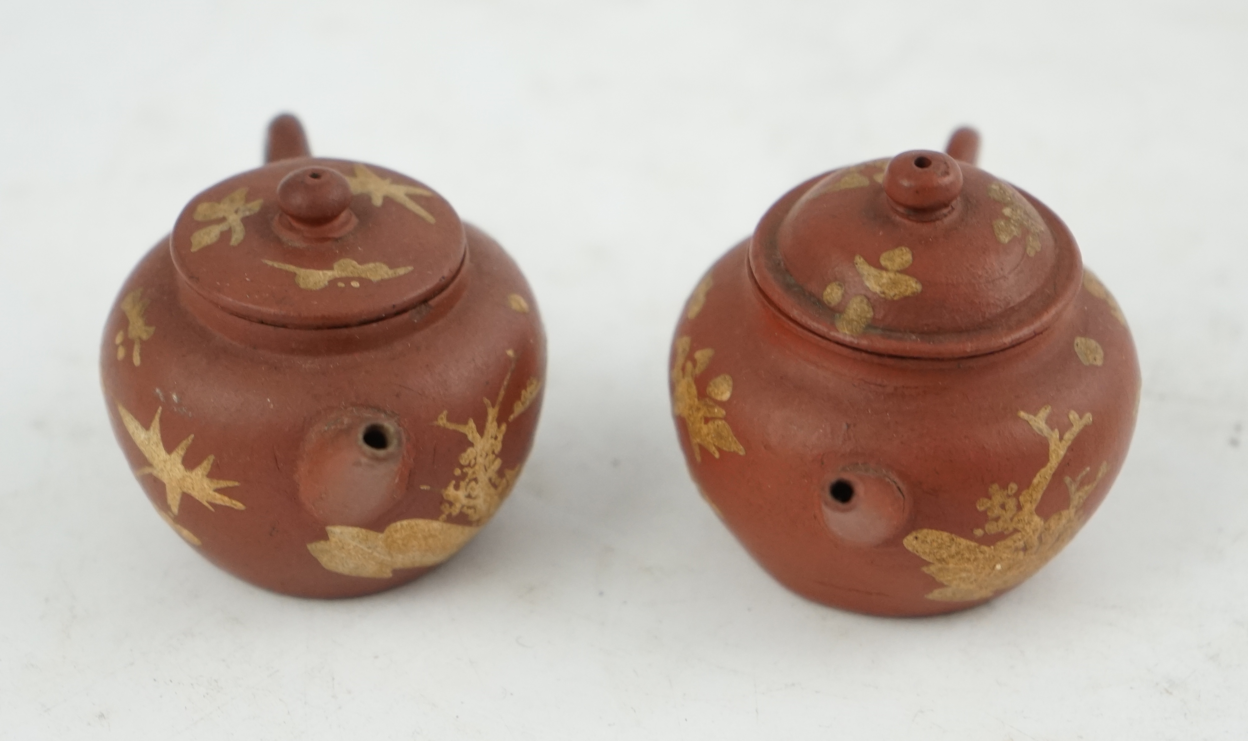 Two Chinese Yixing slip-decorated miniature teapots and covers, 18th/19th century